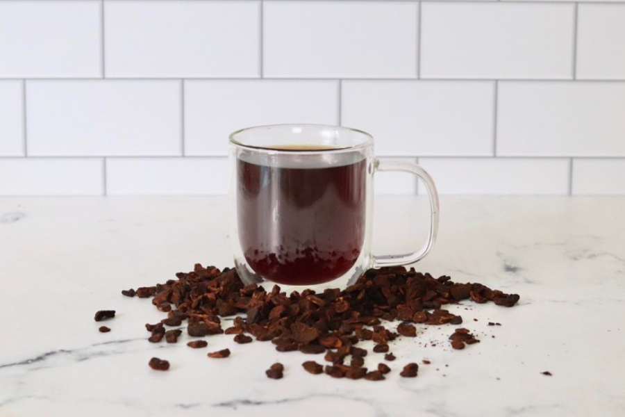 Cup of organic loose leaf tea I Can't Believe it's Not Coffee on a marble benchtop.